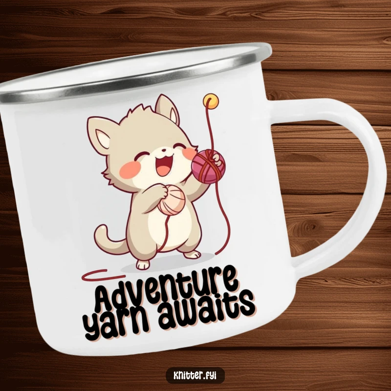 Funny camping mug showing a creature gleefully batting a dangling thread from a ball of yarn, perfect for outdoor fun.