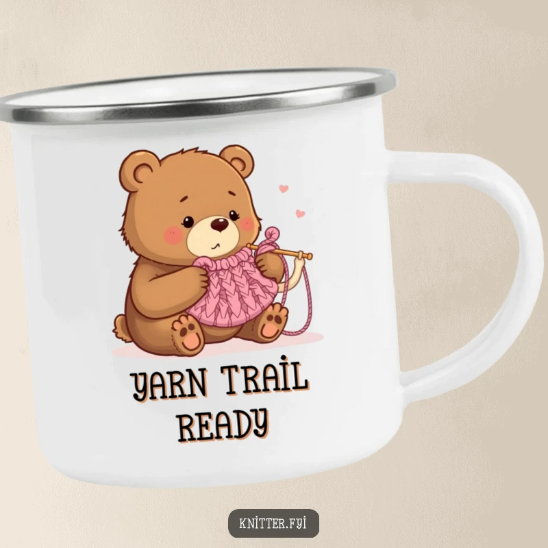 Funny camping mug with a bear humorously knitting a tea cozy using oversized needles, suitable for outdoor use.
