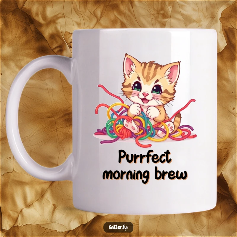 Funny playful kitten mug, happily tangled in a colorful ball of yarn, with a mischief-loving and pleased expression.