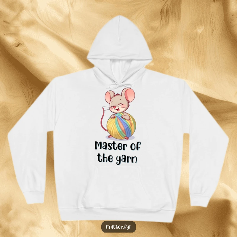 Funny Hoodie depicting a cheerful mouse character spinning a large ball of colorful yarn, symbolizing cozy creativity and happiness.
