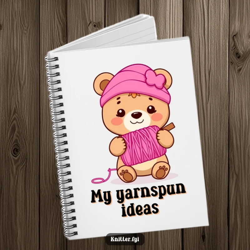 Funny bear cub notebook holding a spool of vibrant pink yarn, smiling, ideal for journaling and note-taking.