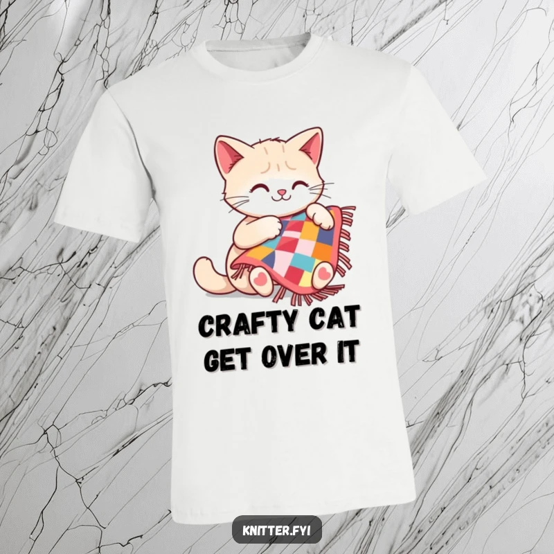 Funny cat t-shirt with a cheerful cat focused on sewing a small, detailed quilt, looking very pleased.