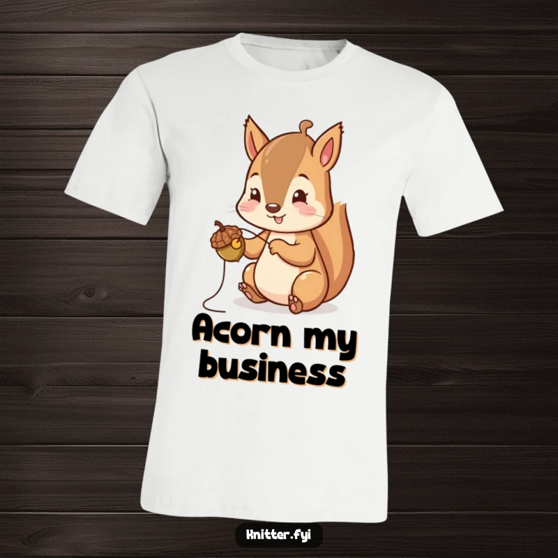 Funny Squirrel T-Shirt: A cheerful squirrel is shown carefully stitching a tiny acorn cap, embodying woodland artistry.