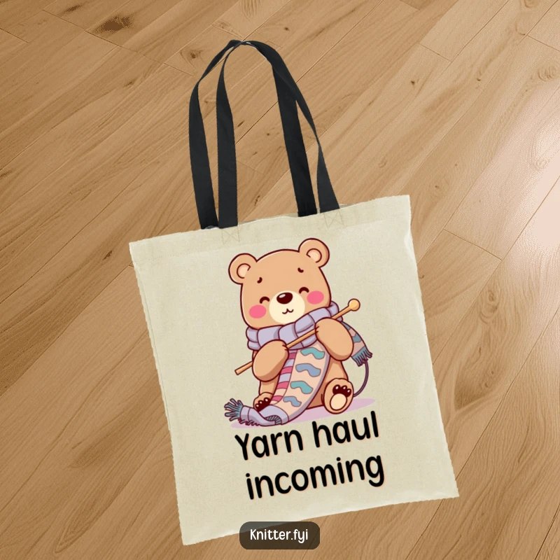 Funny tote bag with a cheerful bear character knitting a long, vibrant scarf, ideal for carrying knitting supplies.